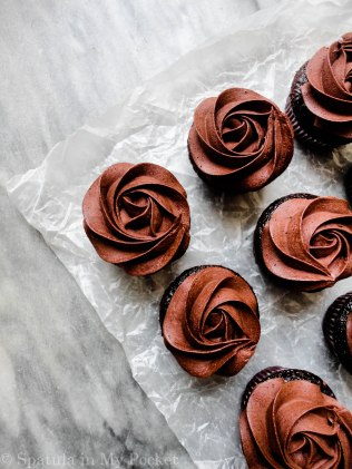 Moist chocolate cupcakes topped with a fudgy chocolate frosting